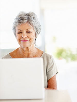 older woman looking at computer screen